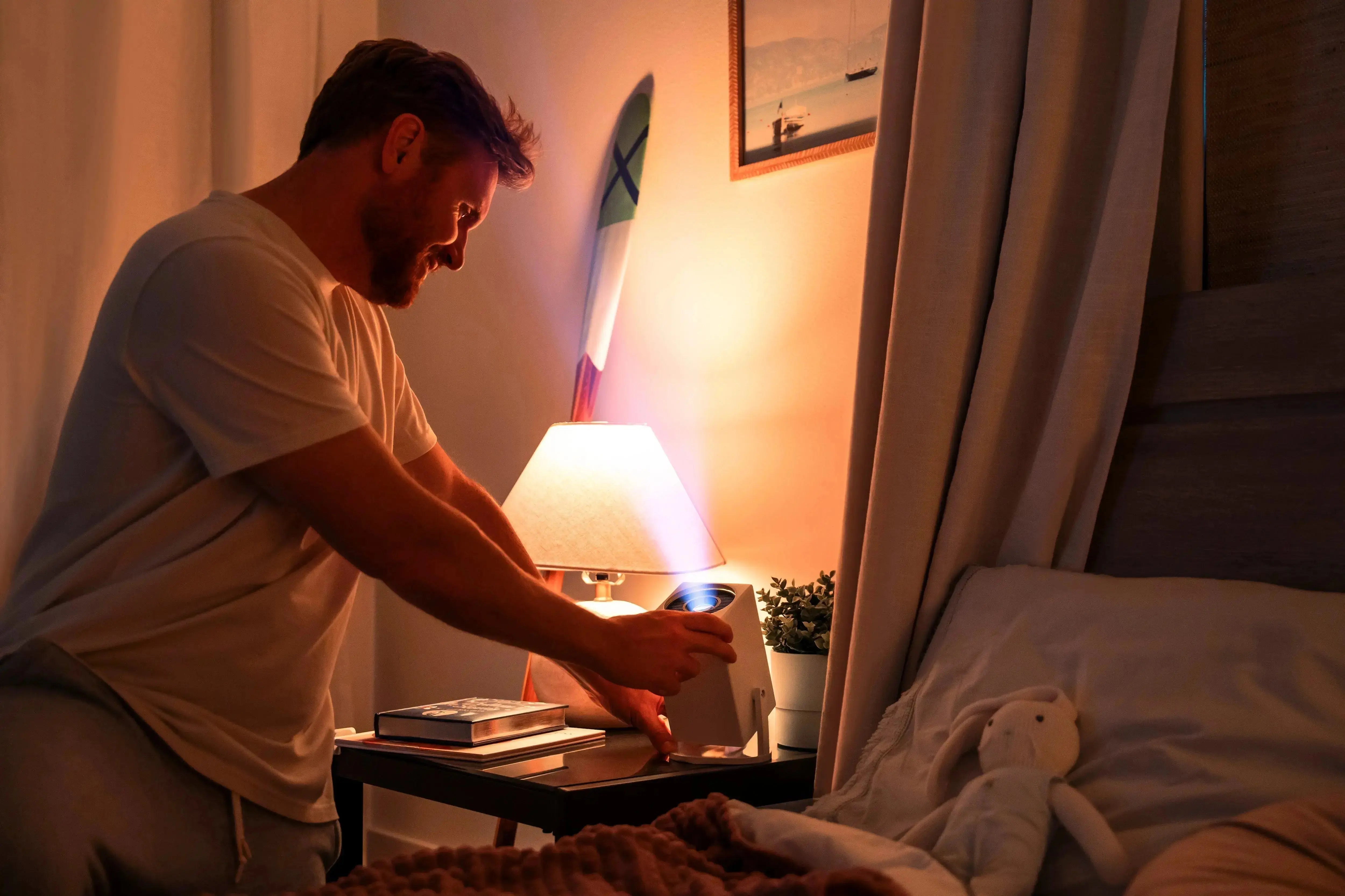 Father turning on the Ozmotic Learning Projector